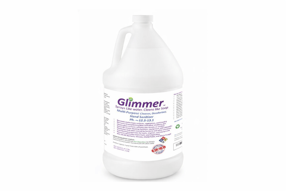 Glimmer all-natural effective cleaning disinfectant spray and hand sanitizer bottle on white background